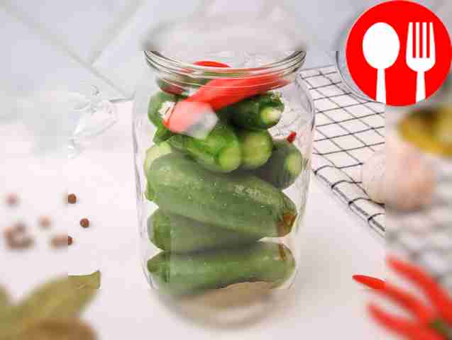 Затем уложите в банку огурцы, начиная с самых...