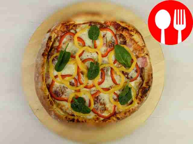 Выпекайте пиццу в разогретой до 200°С духовке...